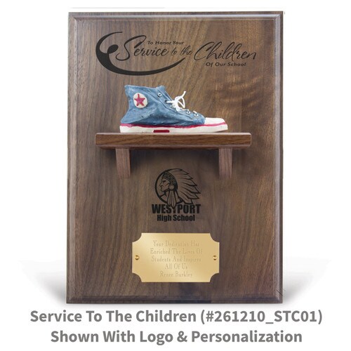 service to the children message on a walnut plaque with a shelf, resin blue shoe and personalized brass plate