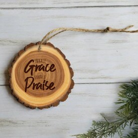 wooden ornament with inhale grace exhale praise message