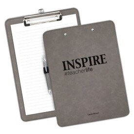 9"w x 12.5"h Richly Textured Clipboard Featuring The Inspirational Message: Inspire #teacherlife. Available In 5 Colors.