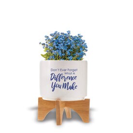 Two-piece bamboo stand with modern white ceramic planter featuring the inspirational message “Don’t Ever Forget What A Difference You Make.” Grows forget-me-nots.