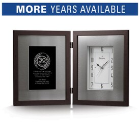 Bulova Large Framed Clock with brushed aluminum inner frame and espresso-brown solid wood outer frame. Displays years of service recognition on the left side.